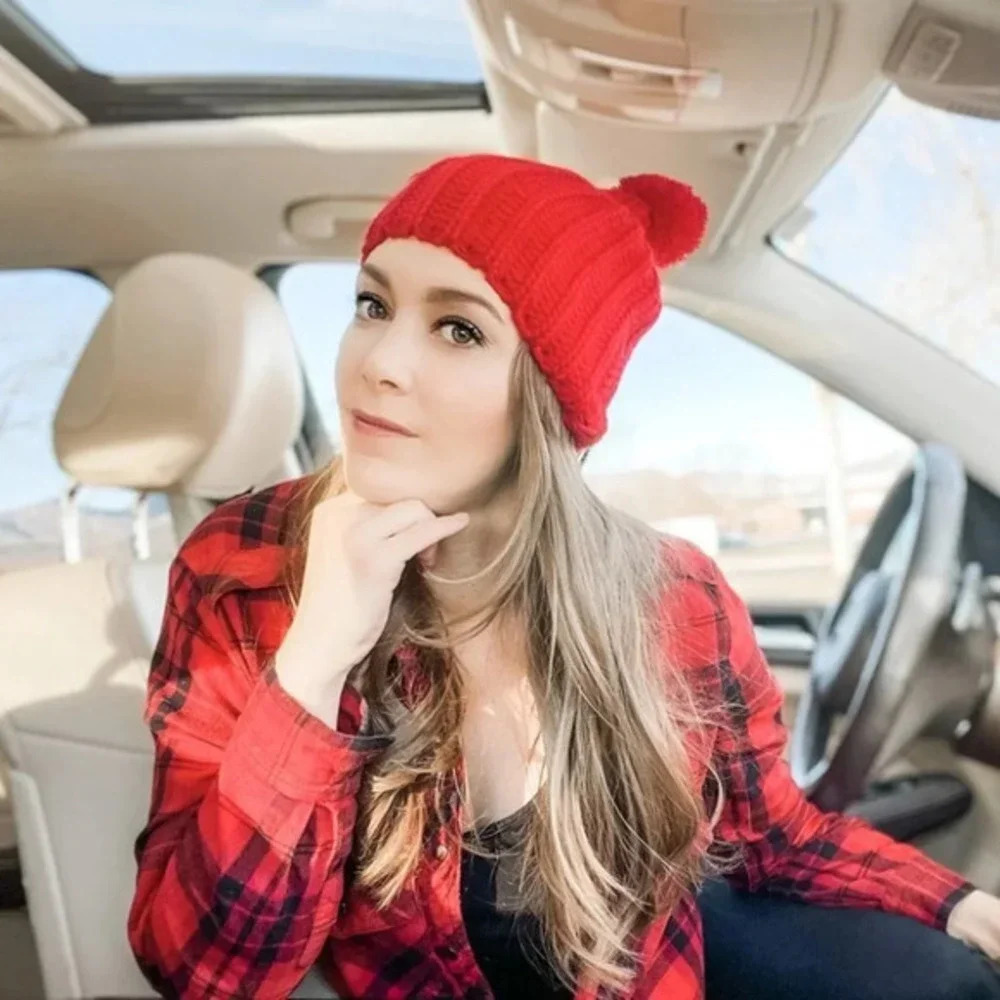 Red beanie fuzz ball hat
